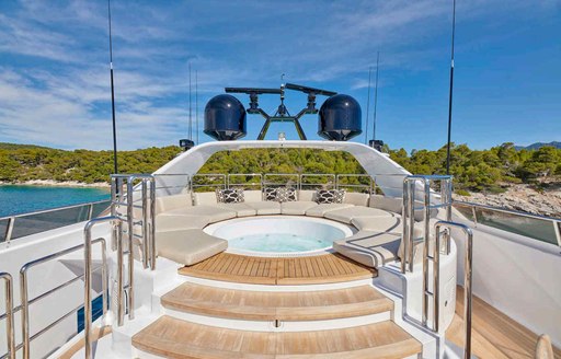 divine sun deck jacuzzi onboard luxury charter yacht