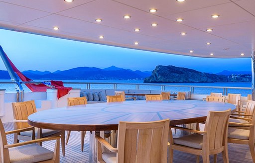 alfresco dining area on the upper deck aft of motor yacht BOADICEA 