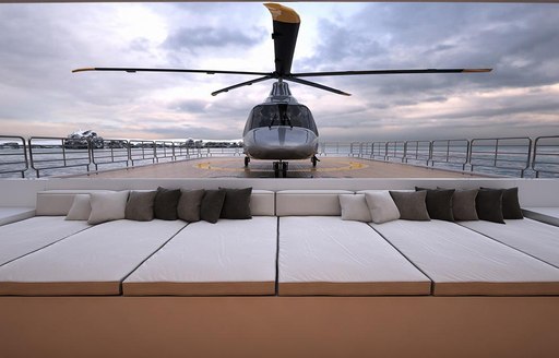 helicopter onboard luxury superyacht charter explorer yacht Planet Nine