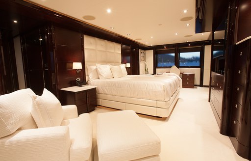 large bed and deep sofa in the master suite on board motor yacht TRENDING 