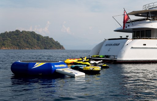 view of stern on board motor yacht ‘Seven Sins’ alongside water toys