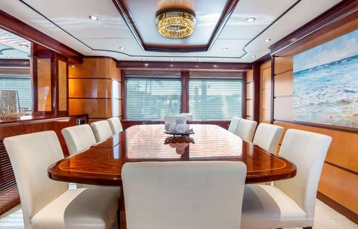 Charter yacht JUST ENOUGH interior dining area with adjacent window