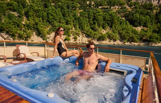Charter yacht SEAGULL II charter guests in deck Jacuzzi