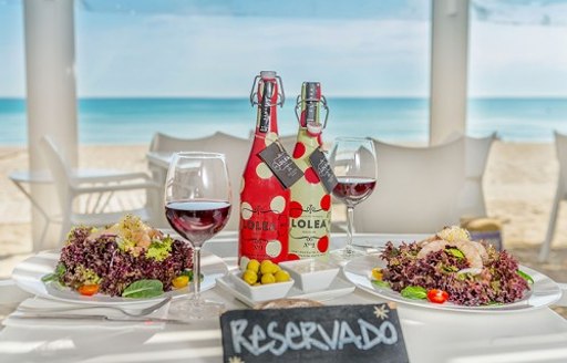 outdoor dining table at Ponderosa Beach in Mallorca, the Balearics