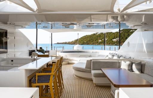 Charter yacht HOLDIN' MY OWN sun deck with wet bar