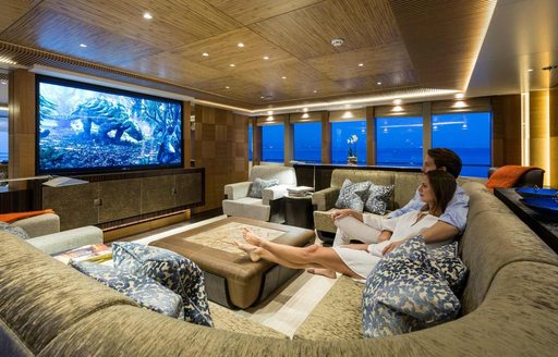 charter guests relax in movie lounge on board superyacht RUYA