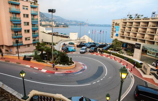 Tight, hairpin bend of the circuit of the Monaco Grand Prix, with the sea visible in the background