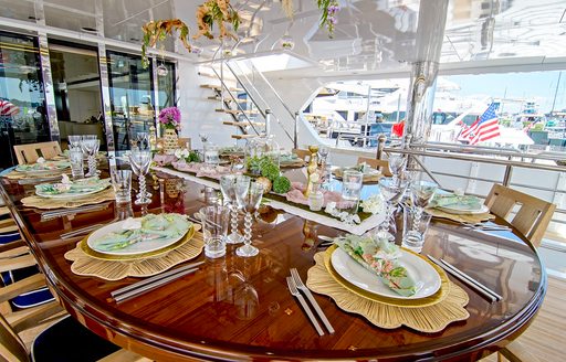 Decorated oval dining table on superyacht