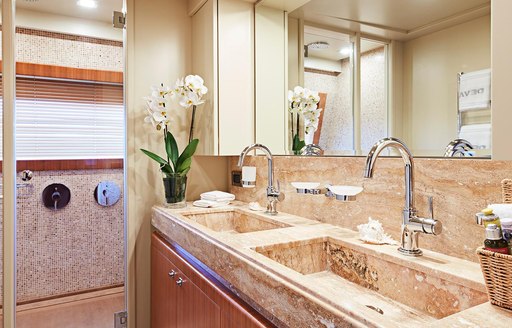 en-suite bathroom with marble and modern fixtures on board luxury yacht DEVA