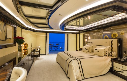 The master suite and retractable balcony on motor yacht OKTO