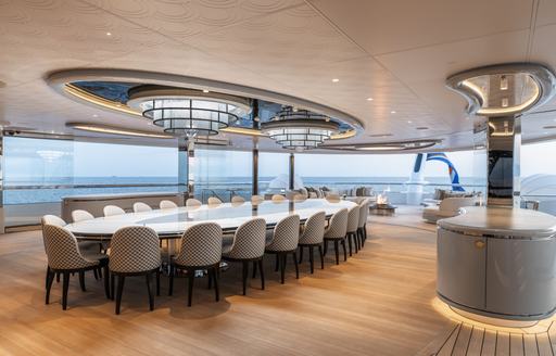 Alfresco dining table and seats onboard charter yacht KISMET