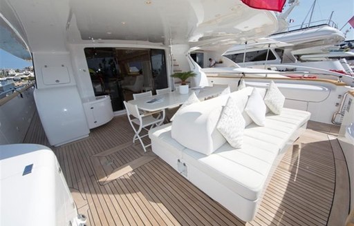 alfresco dining and lounging on aft deck of motor yacht Tuscan Sun