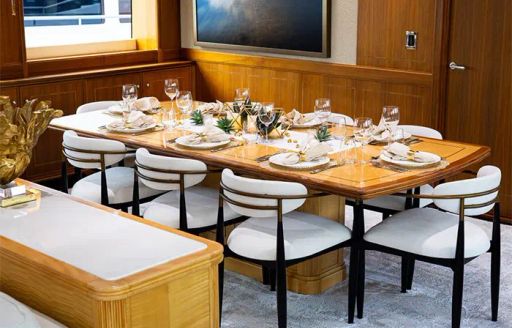 Interior dining area onboard charter yacht INVICTUS 