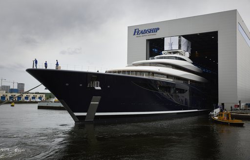 Frontal view of Feadship Project 821 bow leaving construction yard