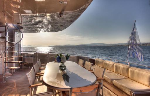 Charter yacht PANDION exteriors with seating and a table