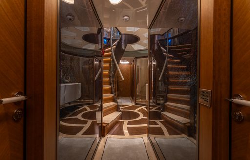 Interiors onboard charter yacht ETERNAL SPARK with spiral staircase