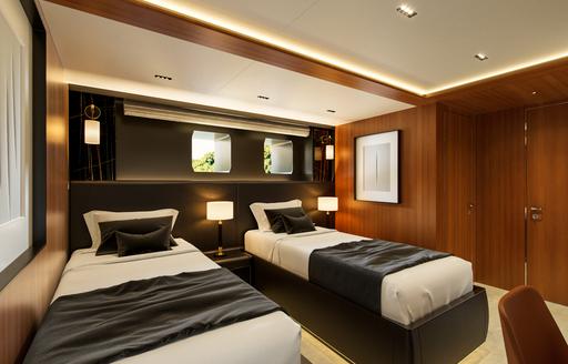 Twin cabin with two single berths and porthole windows onboard charter yacht SAIRU