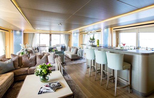 laid back skylounge with seating and bar on board charter yacht BLUSH 