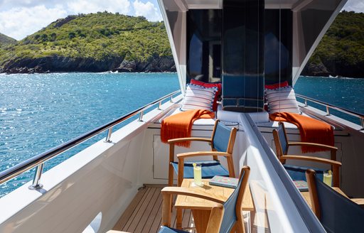 chairs and table on side balcony of skylounge on board motor yacht ‘Victoria del Mar’ 