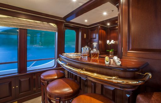 Charter yacht TELEOST wet bar and three stools