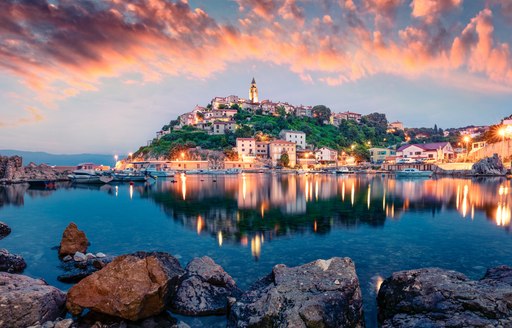 Breathtaking evening cityscape of Vrbnik town. Dramatic summer seascape of Adriatic sea, Krk island, Kvarner bay archipelago, Croatia, Europe. Beautiful world of Mediterranean countries.