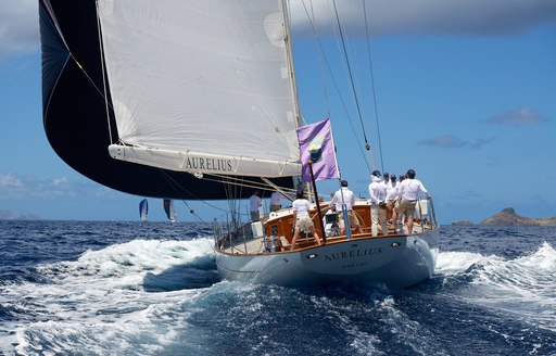 Sailors on stern of boat at St Barths Bucket Regatta