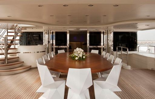 Exterior dining table onboard charter yacht ELENI