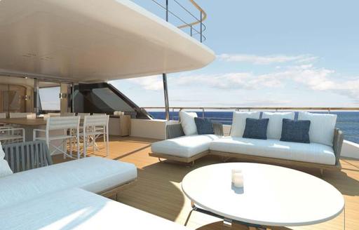 Charter yacht DAWO exterior deck with white seating and table