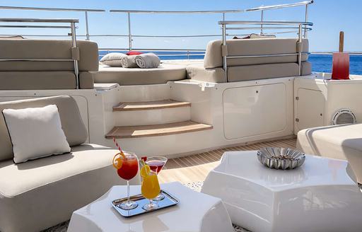 Charter yacht BUNKER exteriors with steps to Jacuzzi