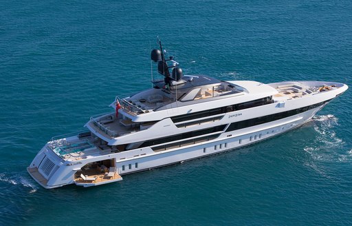 aerial shot of Lady Lena by sanlorenzo providing a view of her main deck swimming pool, extendable side deck which open up to her beach club, upper alfresco dining area, capacious forward deck, nd spacious sun deck