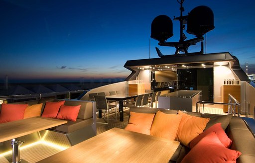 Sundeck of superyacht 4A flydeck lit up at night 