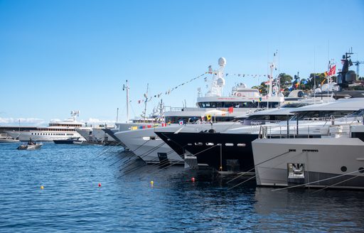 Line of superyacht bows at Monaco Yacht Show