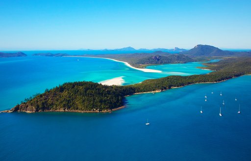 Idyllic Whitsunday Islands with blue seas and white sand, Australia