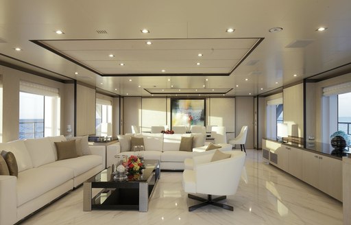 The marble flooring and fresh white sofa seating on board superyacht WILLOW