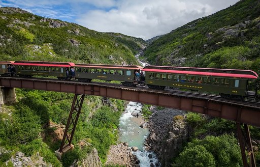 White Pass & Yukon Route Railway train going over bridge