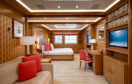 Charter yacht ALFA NERO guest cabin with double berth and private seating area