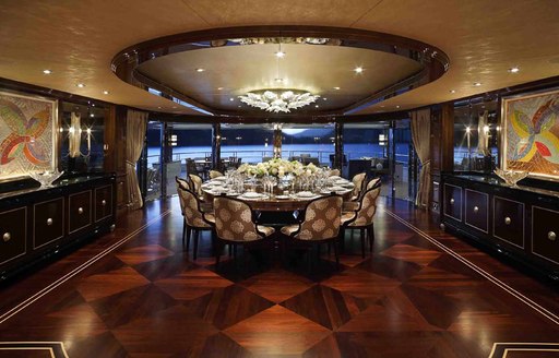 indoor dining area onboard beautiful yacht INVICUTUS