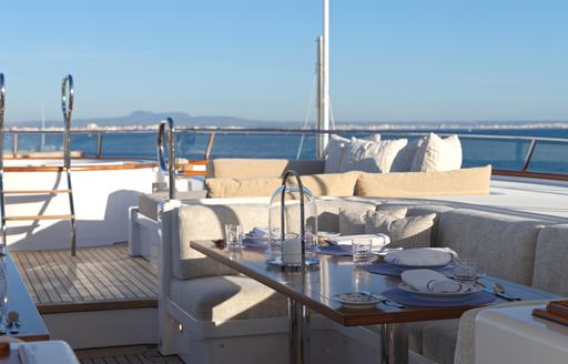 Charter yacht SOLACE exterior deck space with dining option