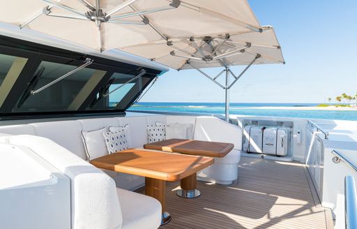 Exterior seating area onboard yacht rental SANTOSHA