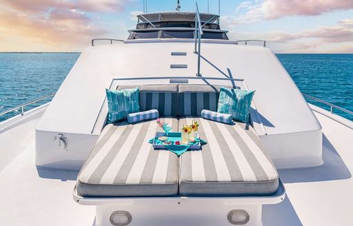 Charter yacht MARGATE sunpads and teal cushions