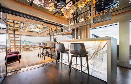 Charter yacht RAJA² wet bar with stools