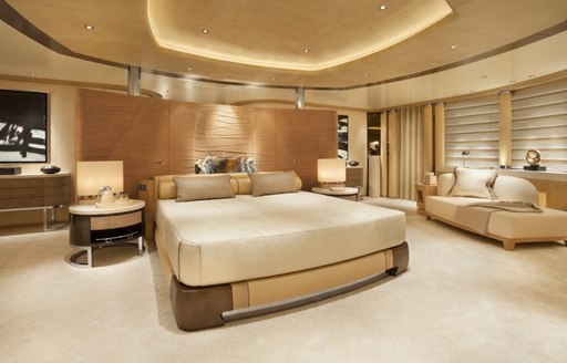 large bed in the master suite with panoramic views aboard charter yacht GRACE 