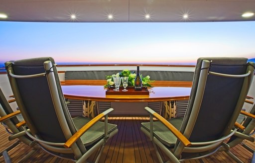 Alfresco dining on aft deck of motor yacht Axantha II