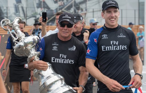 Grant Dalton from Team New Zealand holds the Auld Cup