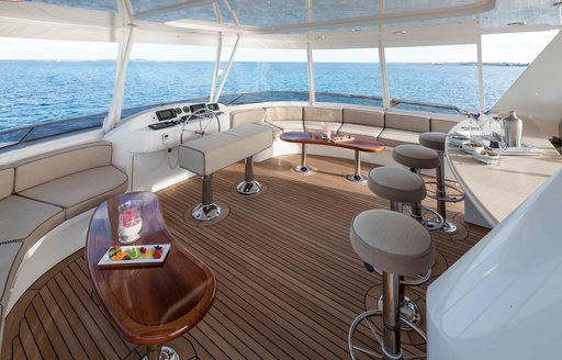 bar and seating covered by Bimini on board charter yacht AMITIÉ 