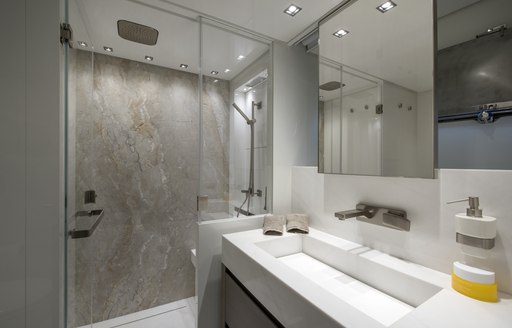 en-suite bathroom with marble shower on board luxury yacht DINAIA 