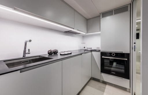 Galley area on motor yacht BEYOND, sink and cooker visible