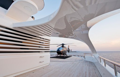 Helipad and stationary helicopter onboard charter yacht DREAM