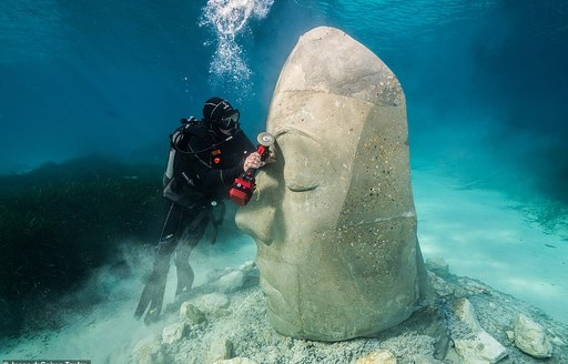 Artist Jason deCaires Taylor chiselling a sculpture for the Cannes Underwater Museum