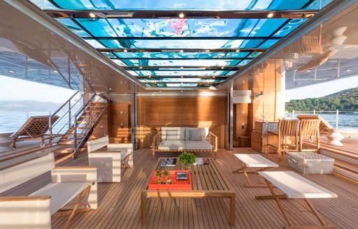 Charter yacht SEVEN SINS beach club under swimming pool